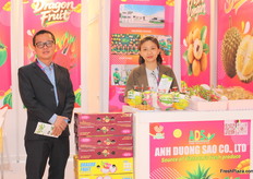 Tu Phan, Managing Director of Ahn Duong Sao, showcases tropical fruits including dragon fruit, durian, coconut, pomelo, mangoes, mangosteen, longan, lychee, and guavas.